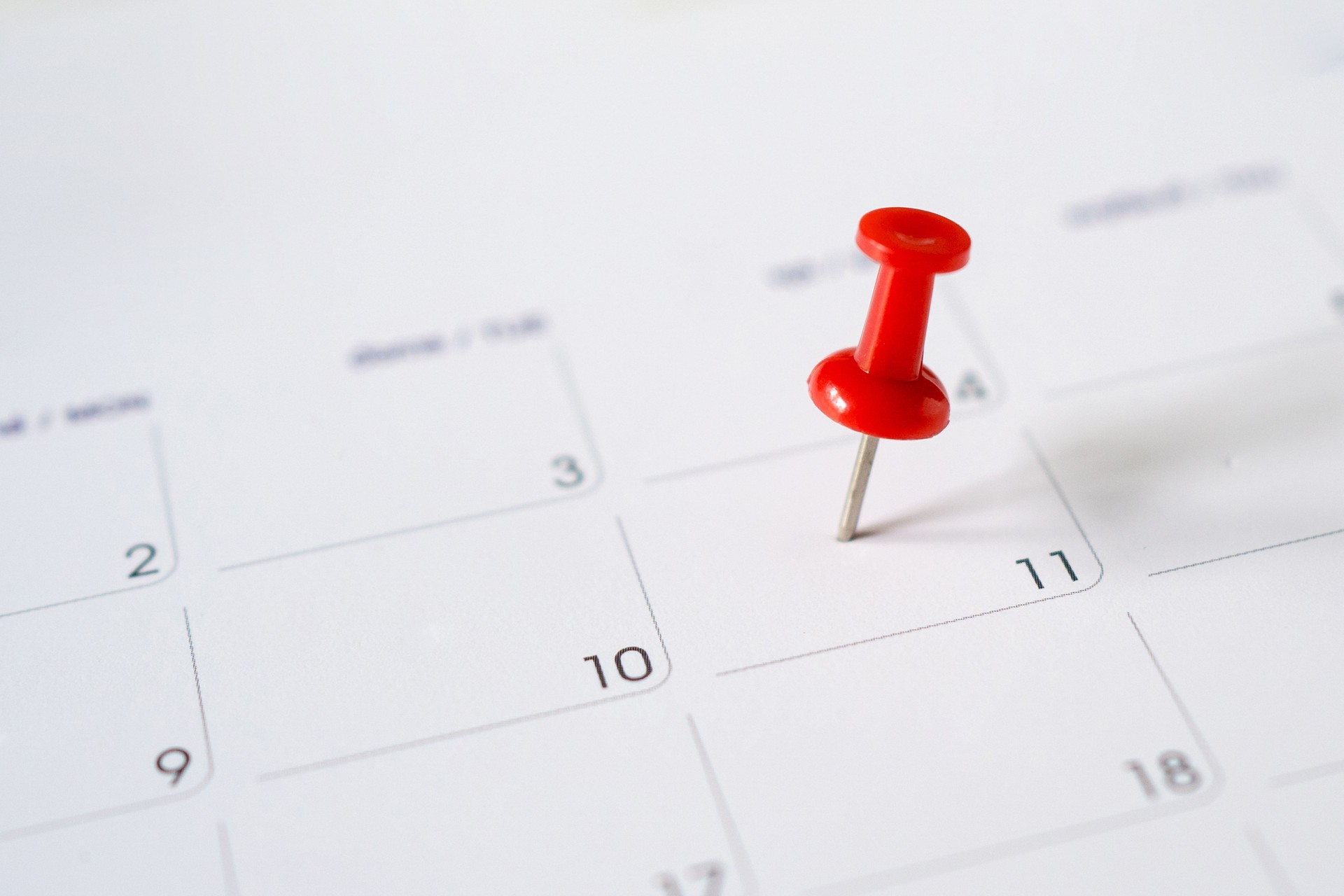 Calendar with red pin on the 11th.
